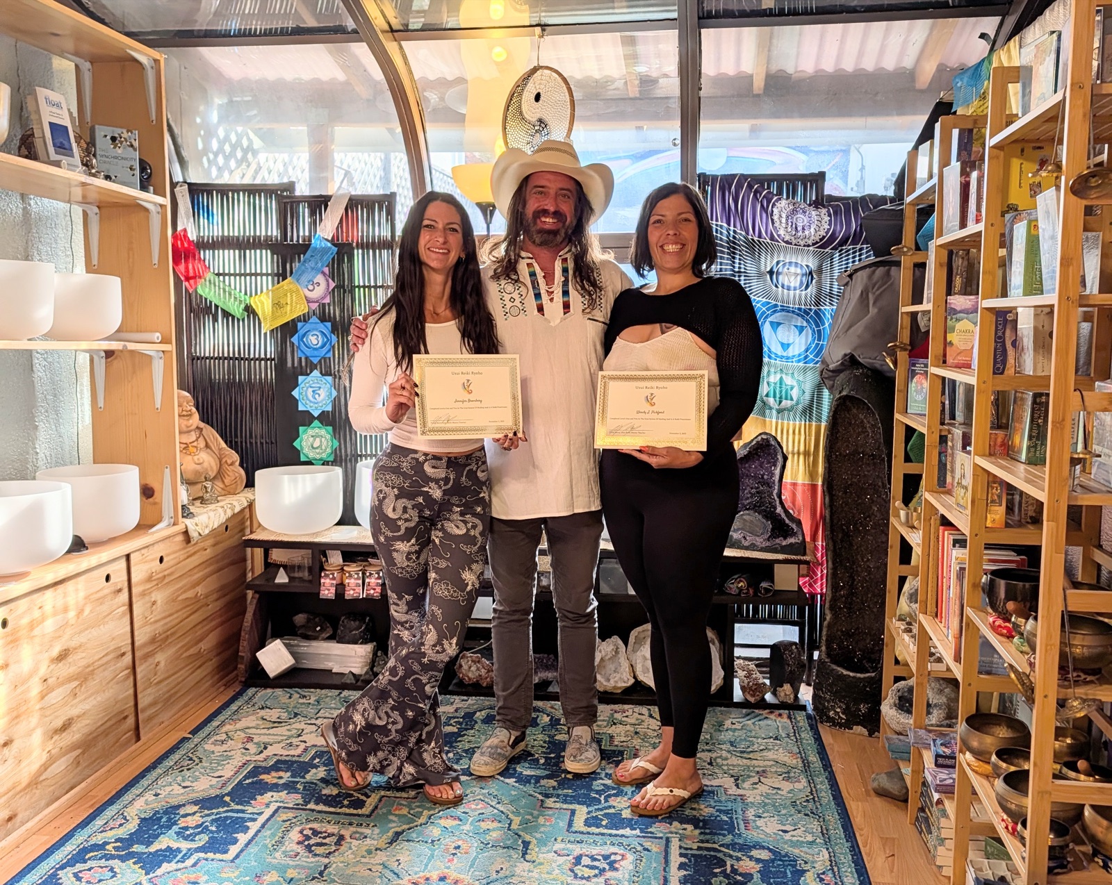 Philip Berry with Reiki students holding their Usui Reiki Ryoho certificates at Crystal Visions Rock Shop